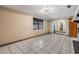Bright living room featuring tile floors and an arched entry, filled with natural light at 9236 Suncoast Terrace, Hudson, FL 34667