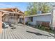 Spacious wood deck area with a pergola, exterior of the home, and landscaping creating an inviting outdoor space at 9236 Suncoast Terrace, Hudson, FL 34667