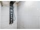 A shower with a sleek black shower panel and white tiles create a modern and minimalist space at 9236 Suncoast Terrace, Hudson, FL 34667