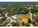 Aerial view of community amenities, including a baseball field, pond, and community center at 10605 Carrollbrook Ln, Tampa, FL 33618