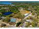 Aerial view of community amenities, including a tennis court, pond, and baseball field at 10605 Carrollbrook Ln, Tampa, FL 33618