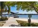 Bathing beach with covered picnic tables overlooking the lake and boat ramp at 10605 Carrollbrook Ln, Tampa, FL 33618