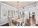 Charming dining area with a decorative chandelier and white wood trim at 10605 Carrollbrook Ln, Tampa, FL 33618