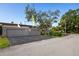 Attached two-car garage offers convenience, complemented by a well-maintained driveway and mature landscaping at 10605 Carrollbrook Ln, Tampa, FL 33618