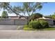 Attached two-car garage offers convenience, complemented by a well-maintained driveway and mature landscaping at 10605 Carrollbrook Ln, Tampa, FL 33618
