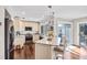 Well-lit kitchen with granite countertops, stainless steel appliances, and a breakfast bar with seating at 10605 Carrollbrook Ln, Tampa, FL 33618