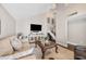 Comfortable living room featuring a large sofa, decorative pillows, and a modern entertainment center at 10605 Carrollbrook Ln, Tampa, FL 33618