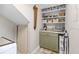 Organized pantry area with shelving, providing ample storage for kitchen and household items at 10605 Carrollbrook Ln, Tampa, FL 33618