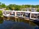 Aerial view of waterfront property with multiple decks and patios overlooking the water at 10605 Carrollbrook Ln, Tampa, FL 33618