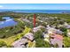 Aerial view of property in community near waterfront with mature trees, road frontage, and convenient location at 1003 Teal Pointe, Tarpon Springs, FL 34689