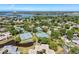 Beautiful aerial view of the community with tennis courts, lakes, and lush landscaping at 1003 Teal Pointe, Tarpon Springs, FL 34689