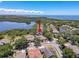 A beautiful aerial view of a home in a waterfront neighborhood, showcasing its proximity to the water and lush surroundings at 1003 Teal Pointe, Tarpon Springs, FL 34689