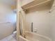 Bathroom featuring a shower-tub combination with white tiles and grab bars at 1003 Teal Pointe, Tarpon Springs, FL 34689