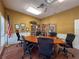 Conference room with meeting table, rolling chairs, a flag and filled bookshelves at 1003 Teal Pointe, Tarpon Springs, FL 34689