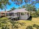 Exterior angle of house with a screened-in porch at 1003 Teal Pointe, Tarpon Springs, FL 34689