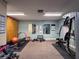 Community gym featuring weight training equipment, free weights, and storage cabinets at 1003 Teal Pointe, Tarpon Springs, FL 34689