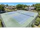 Enjoy tennis on the community courts, surrounded by lush landscaping and a peaceful pond view at 1003 Teal Pointe, Tarpon Springs, FL 34689