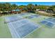 Aerial view of the community tennis and pickleball courts, perfect for active living at 1003 Teal Pointe, Tarpon Springs, FL 34689