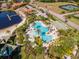 Aerial view of community pool, lake, and surrounding amenities at 10528 Bermuda Isle Dr, Tampa, FL 33647