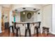 Interior shot of a bar with counter, chairs and decorative lighting, and wood floors at 10528 Bermuda Isle Dr, Tampa, FL 33647