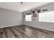 Spacious bedroom with hardwood floors, natural light, and sports decor create a unique atmosphere at 10528 Bermuda Isle Dr, Tampa, FL 33647