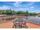 Waterfront deck with outdoor dining area offers stunning views of the lake at 10528 Bermuda Isle Dr, Tampa, FL 33647