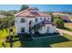 Beautiful two-story home featuring a red tile roof, well-kept lawn, and professional landscaping at 10528 Bermuda Isle Dr, Tampa, FL 33647