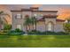 Stunning two-story home boasts a lush green lawn, mature landscaping, and a terracotta tile roof at 10528 Bermuda Isle Dr, Tampa, FL 33647