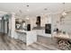 Open-concept kitchen boasts white cabinets, a marble island, and stainless steel appliances at 10528 Bermuda Isle Dr, Tampa, FL 33647