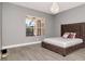 Cozy main bedroom with a statement bed, window views, and soft natural light at 10528 Bermuda Isle Dr, Tampa, FL 33647