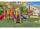 Colorful playground features multiple slides, climbing structures, and shaded seating area for outdoor fun at 10528 Bermuda Isle Dr, Tampa, FL 33647