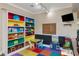 Bright and colorful playroom with built-in bookshelves and fun play areas at 10528 Bermuda Isle Dr, Tampa, FL 33647