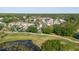 Beautiful aerial of homes on a golf course with lush greens, ponds, and mature trees at 11209 Pocket Brook Dr, Tampa, FL 33635