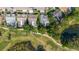 Aerial view of homes with pools and lush landscaping, backing onto a golf course at 11209 Pocket Brook Dr, Tampa, FL 33635