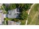 Overhead shot of a home with a pool, set among mature trees and green lawns at 11209 Pocket Brook Dr, Tampa, FL 33635