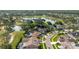 Aerial view showcases a house near a golf course, providing scenic views and recreational opportunities at 11209 Pocket Brook Dr, Tampa, FL 33635