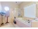 Tiled bathroom featuring a large bathtub, shower, and lots of counter space at 11209 Pocket Brook Dr, Tampa, FL 33635