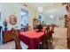 Dining room shows a formal table set for a meal and a view towards the kitchen at 11209 Pocket Brook Dr, Tampa, FL 33635