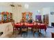 Dining room featuring a formal table, chandelier, and light walls and flooring at 11209 Pocket Brook Dr, Tampa, FL 33635