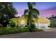 Beautiful home with a well-kept yard, two-car garage, and welcoming front seating area, perfect for relaxing at 11209 Pocket Brook Dr, Tampa, FL 33635