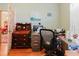 Home office features wood floors, a modern desk, and a view to the living room at 11209 Pocket Brook Dr, Tampa, FL 33635
