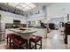 Open eat-in kitchen with breakfast bar, pendant lights and view of the living room at 11209 Pocket Brook Dr, Tampa, FL 33635
