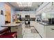 Bright eat-in kitchen with granite counters, stainless steel appliances and island at 11209 Pocket Brook Dr, Tampa, FL 33635