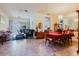 Open-concept living room and dining room boasts tile floors and plenty of natural light at 11209 Pocket Brook Dr, Tampa, FL 33635