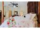 Inviting main bedroom showcasing a four-poster bed and neutral decor at 11209 Pocket Brook Dr, Tampa, FL 33635