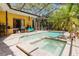 Outdoor living at its finest with a screened in pool and spa at 11209 Pocket Brook Dr, Tampa, FL 33635