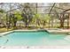 Relaxing screened-in pool area with a spa and lush landscaping, perfect for outdoor enjoyment at 11209 Pocket Brook Dr, Tampa, FL 33635