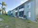 Two-story apartment building with screened in porches and lush green lawns at 11405 3Rd N St # 2, St Petersburg, FL 33716