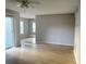 Living room featuring wood laminate flooring, ceiling fan, and neutral paint at 11405 3Rd N St # 2, St Petersburg, FL 33716