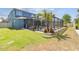 This expansive backyard showcases the home's screened-in pool and spacious grassy area at 11852 Lake Lucaya Dr, Riverview, FL 33579